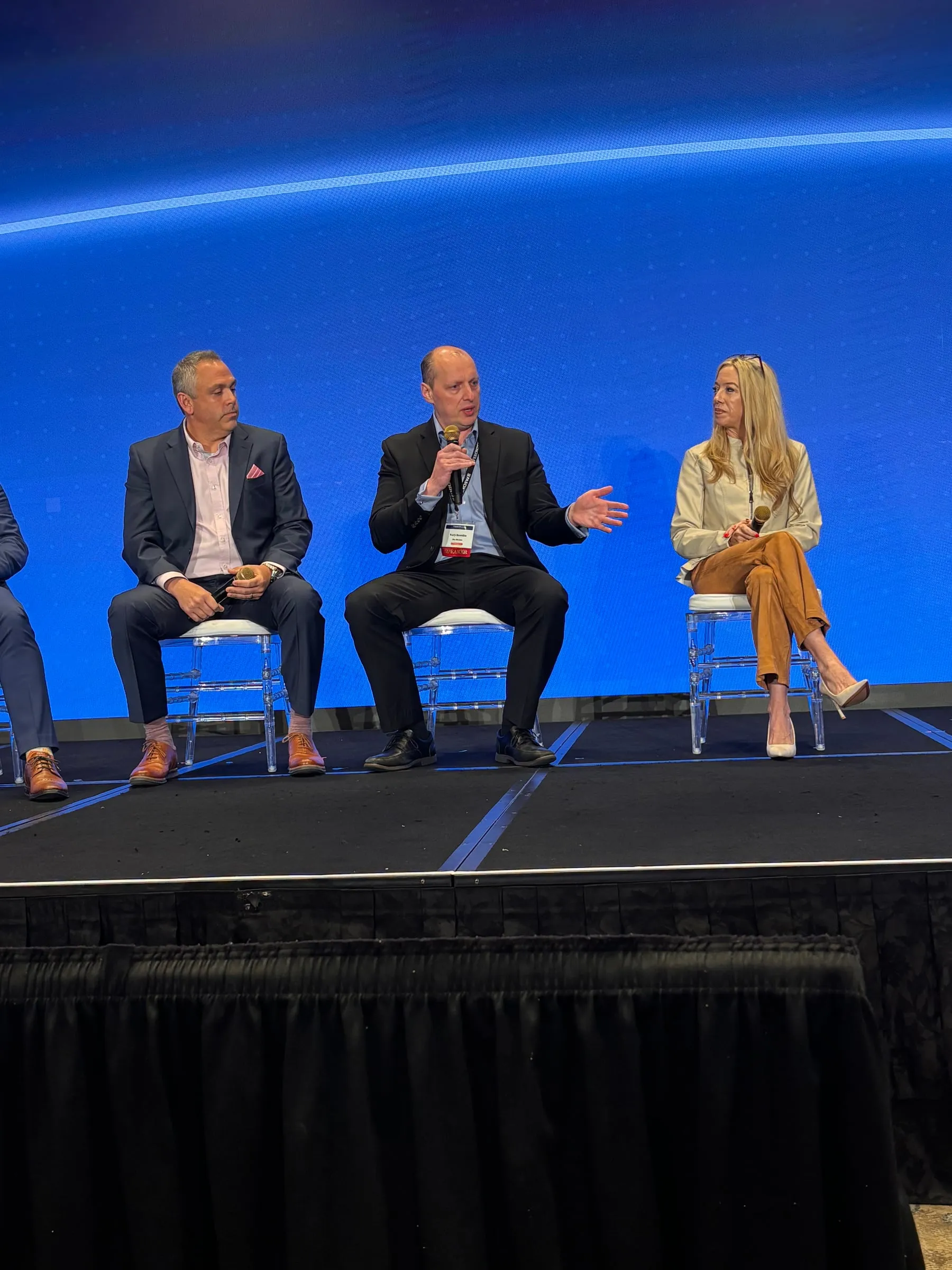 Yuriy Demidko speaking on a panel at the Modern Retailing Conference